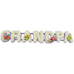 A dignified, horizontal floral display presents the word "GRANDPA" in bold, three-dimensional capitals, laid out in a straight line as though resting on a low stand, with a clean white background keeping every detail crisp and clear. Each letter is completely covered with dense clusters of fresh white chrysanthemums, their small, daisy-like blooms layered tightly together to form a thick, cushioned surface that looks soft, full, and carefully tended. Just beneath the blooms, a trim of light lavender ribbon runs along the base of each letter, the cool purple tone creating a faint border that gently separates the white flowers from the line of dark green supporting bars beneath. These bars, mostly hidden, hold the letters upright and connected, giving the tribute a sense of length and presence that would stand out at the front of a chapel or by a graveside in Norbiton. Colourful floral sprays introduce warmth and character: deep red anthuriums, with their waxy, heart-shaped petals and central yellow spadices, cluster on the 'G' and echo again on the 'D', set off by glossy green foliage that frames the blooms. The first 'A' and the last 'A' carry smaller, more delicate clusters of yellow-green orchids, their softly arching petals and intricate centres lending an air of refined elegance. The overall feel is one of quiet strength and tenderness, a tribute that balances the purity of white with rich, meaningful accents. It is easy to imagine this arrangement chosen by a close-knit family to honour a grandfather whose presence shaped their lives, bringing a sense of comfort and gratitude to a farewell service in the local community.