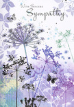 The artwork on this sympathy card feels like a soft-spoken conversation with nature, the kind you might imagine while pausing in a quiet Norbiton garden at dusk. Across the card's surface, slender wildflower stems rise in gentle arcs, topped by intricate umbelliferous clusters that resemble tiny fireworks frozen mid-bloom. These floral silhouettes are painted in soothing shades of lavender, indigo, and soft blue, softened further with misty gradients of silvery green and grey-violet. The watercolour technique allows colours to bleed delicately into one another, so there are no hard borders-just tender transitions that echo the blur of distant trees along roads near Kingston Hospital after a light shower. Among the wispy petals, butterflies drift with almost transparent wings, their outlines just strong enough to suggest form. They hover near the blooms rather than dominating them, embodying the idea of gentle guidance and the quiet presence of loved ones who have passed. The background remains airy and spacious, with only faint hints of additional flora, ensuring the main stems and butterflies remain the focus without feeling heavy or crowded. Light in the scene is diffuse and calm, as though filtered through a soft cloud cover, lending the entire card a contemplative, reflective mood. A short, sincere sympathy message is written in elegant, flowing script above the florals, complementing the artwork rather than competing with it. The design, much like a carefully arranged condolence bouquet from a local Norbiton florist, is thoughtful, understated, and respectful-offering comfort through cool, harmonious colours, graceful lines, and a sense of enduring, natural beauty.