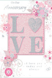 This anniversary card design offers a softly romantic scene, its colours drifting between pastel pinks, pearly whites, and silvery greys that evoke the gentle intimacy of a shared evening in Norbiton. At its heart sits the word LOVE, created from soft, raised letters dusted with fine glitter, so they shimmer subtly when they catch the light. The letter O is transformed into a silver-textured heart, slightly more reflective than the surrounding letters, adding a focal point that feels both playful and deeply sentimental. This central motif rests on a muted blush background panel, balanced and calm, as if it were framed on a shelf in a local Norbiton home. Encircling the word are delicate blooms in blush, mauve, and pale ivory, their petals painted with a watercolor softness and traced with fine, flowing lines that suggest the same care a florist uses when placing each stem in an anniversary bouquet. Gentle flourishes-tiny petals, looping swirls, and suggestive butterfly shapes-add a sense of motion, like a light breeze moving across a garden in nearby Kingston. At the top or bottom, the phrase On Our Anniversary appears in a graceful, modest script, with I love you today and always nestled nearby in matching typography, conveying heartfelt sincerity. The overall impression is of a keepsake designed to accompany fresh flowers delivered locally, its composition whispering of lasting commitment and shared memories, as soft and enduring as a favourite walk through Norbiton's quiet residential streets.